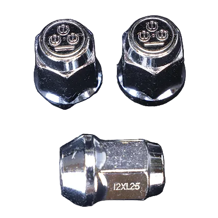 Three metal valve stem caps on a black background