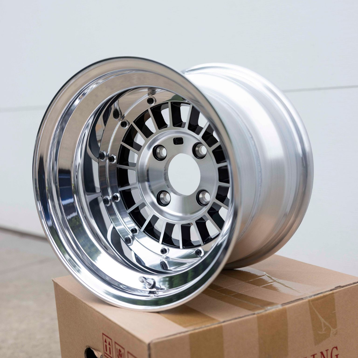 Chrome rim on a cardboard box with 'Focus Racing' branding.