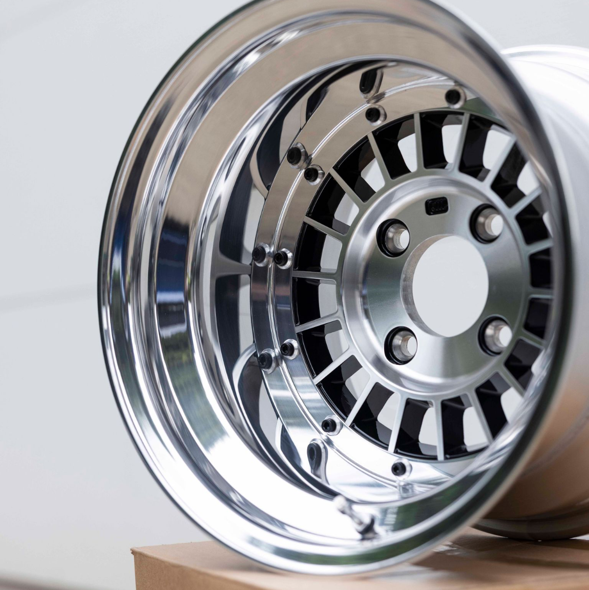 Chrome car wheel rim on a white background
