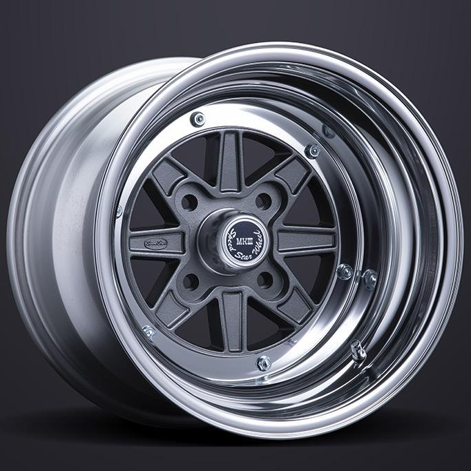 Car wheel rim with metallic finish on a dark background